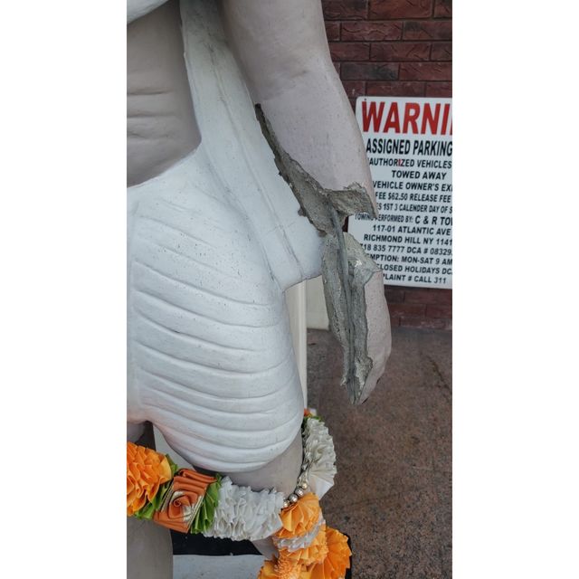 Photos provided by state Assemblywoman Jenifer Rajkumar show the statue with its hand in pieces and arm cracked.